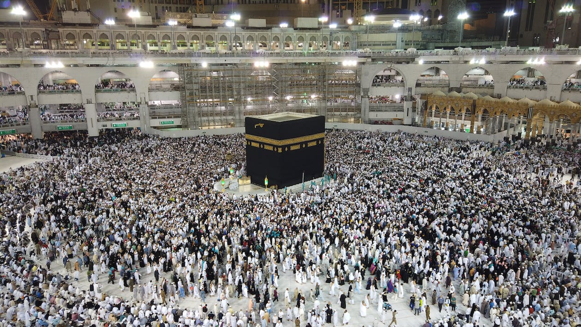 Muslims pray at the Kaaba